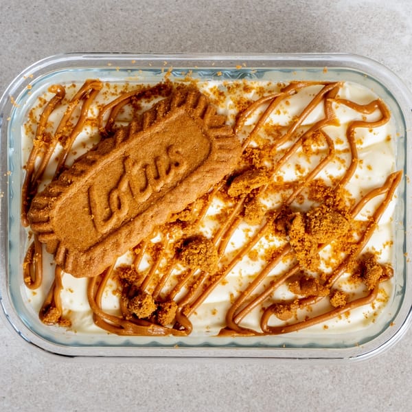 A Sweet Valentine Bakery dessert with a Lotus cookie, caramel drizzle, and cookie crumbles.